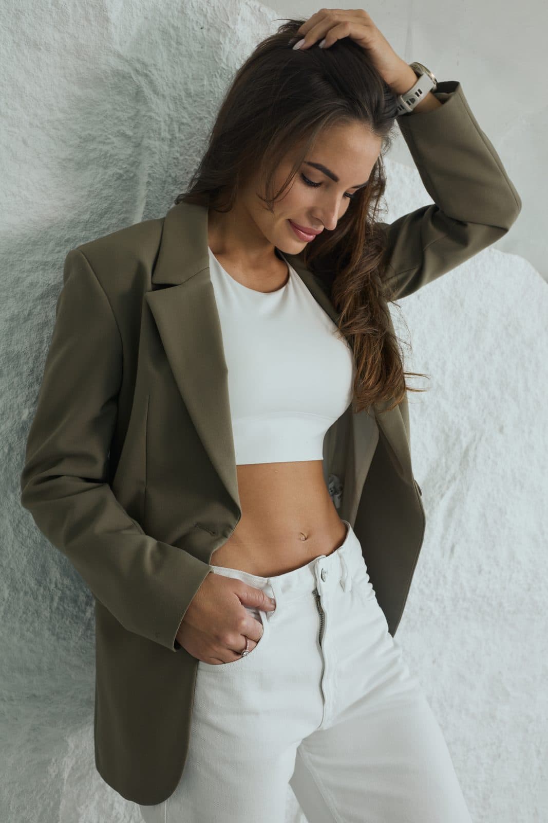 Elle, corporate wellness coach in Dubai, in an olive blazer