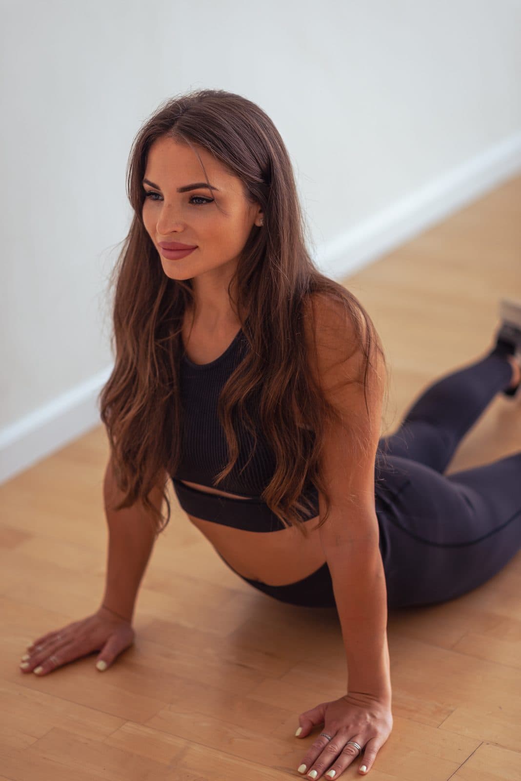 Elle in a calm recovery stretch, illustrating sleep and recovery routines
